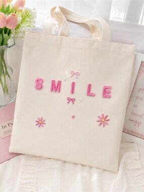 Handmade Cream Canvas Tote Bag with Pink SMILE Embroidery